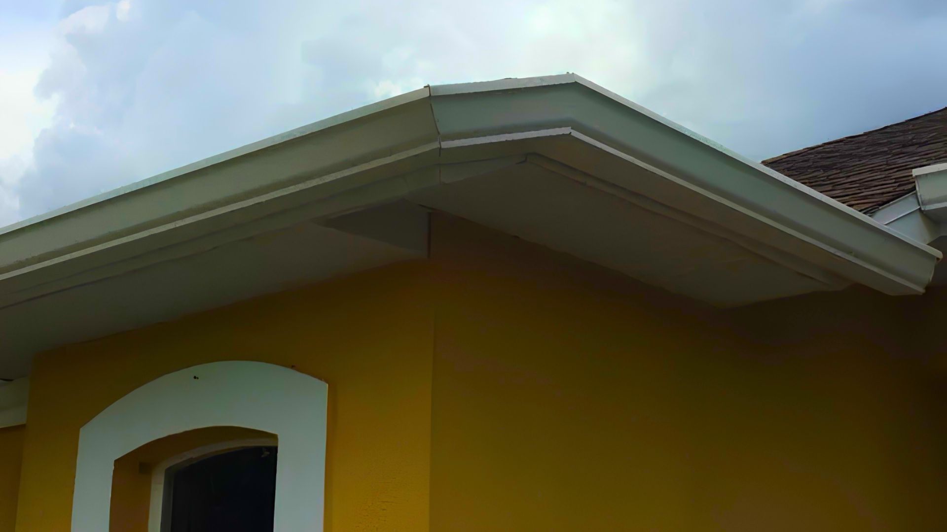 Custom-fit seamless gutter runs measured for a Tampa Bay property